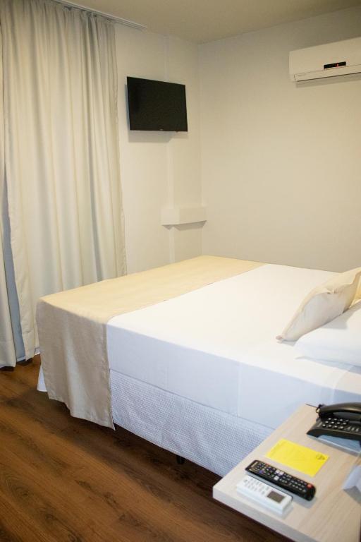 Postel nebo postele na pokoji v ubytování Golden Ingá Hotel