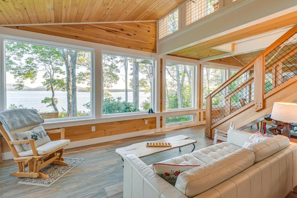 a living room with a couch and a chair at Oceanfront Frenchman Bay Home Stunning View! in Marlboro