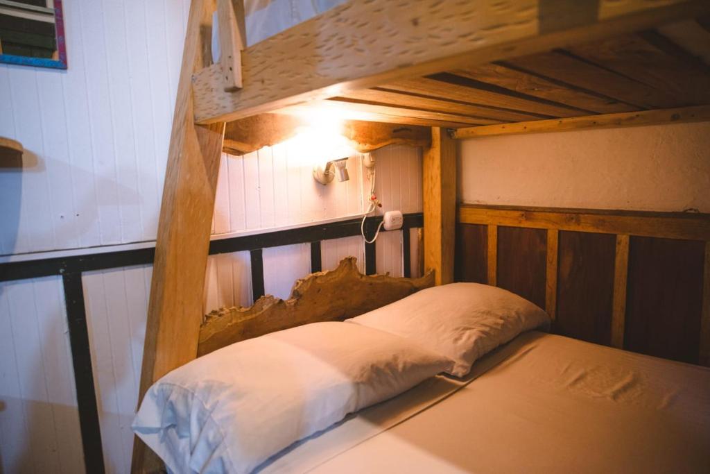 Llit o llits en una habitació de Hostal La Casa De Lili
