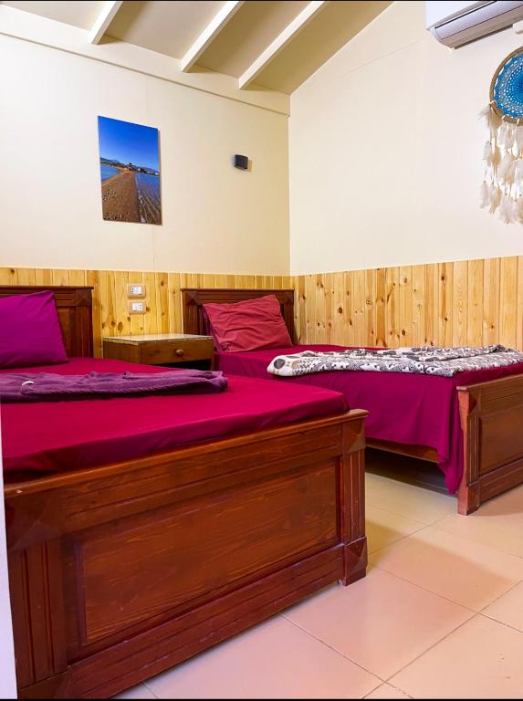 Postel nebo postele na pokoji v ubytování Miramar Camp Dahab