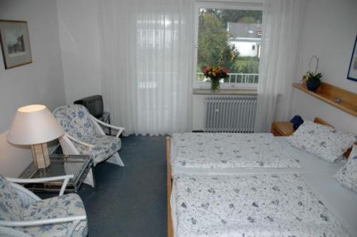 Postel nebo postele na pokoji v ubytování Hotel Ebnet Garni