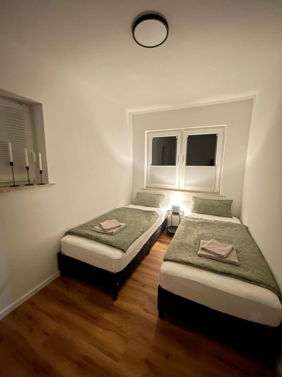 Postel nebo postele na pokoji v ubytování Ferienwohnung am Felsenmeer