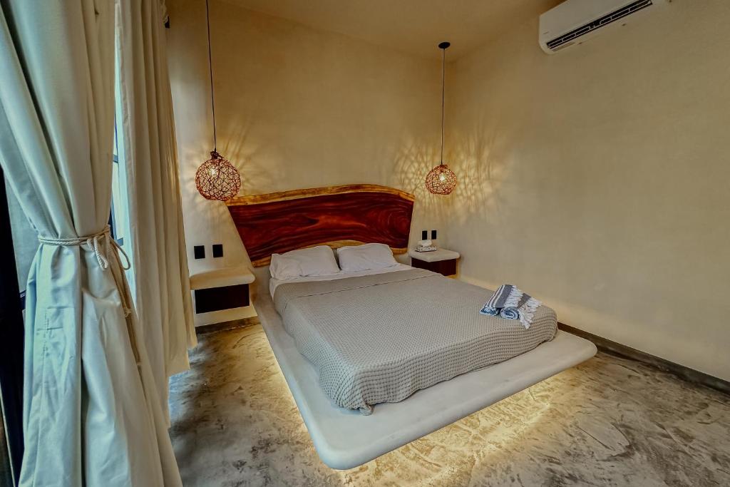 Postel nebo postele na pokoji v ubytování Casa Kobaab Tulum