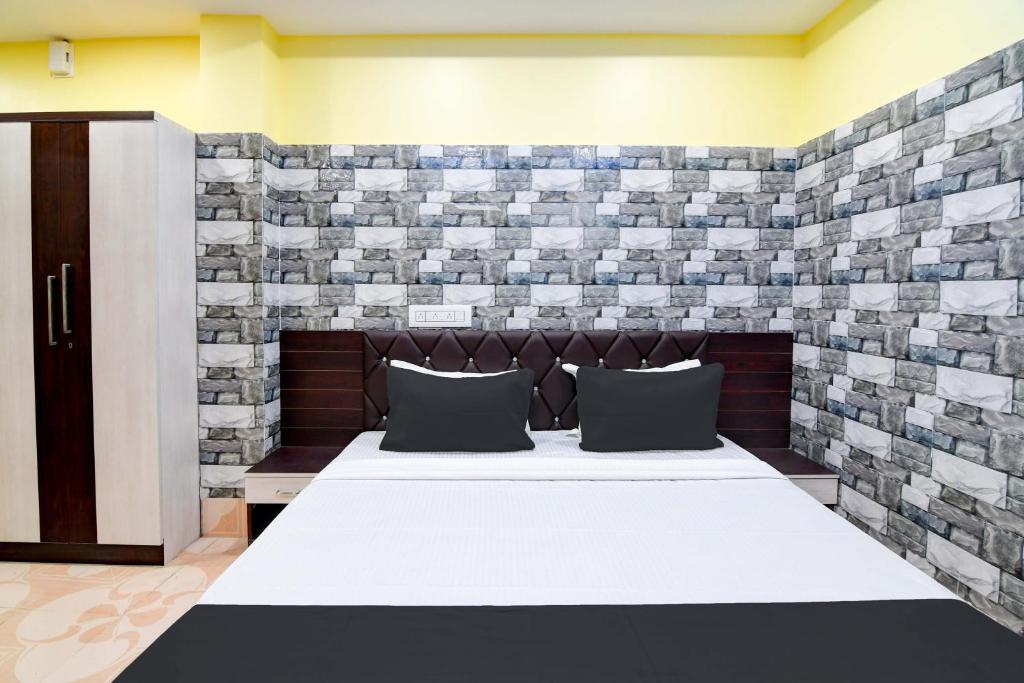 Postel nebo postele na pokoji v ubytování Super Hotel O Anandalok Guest House