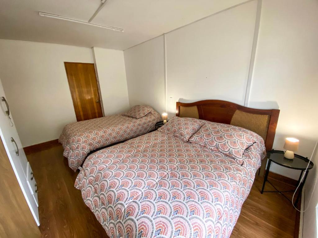 Postel nebo postele na pokoji v ubytování Hostal EntreOrientes