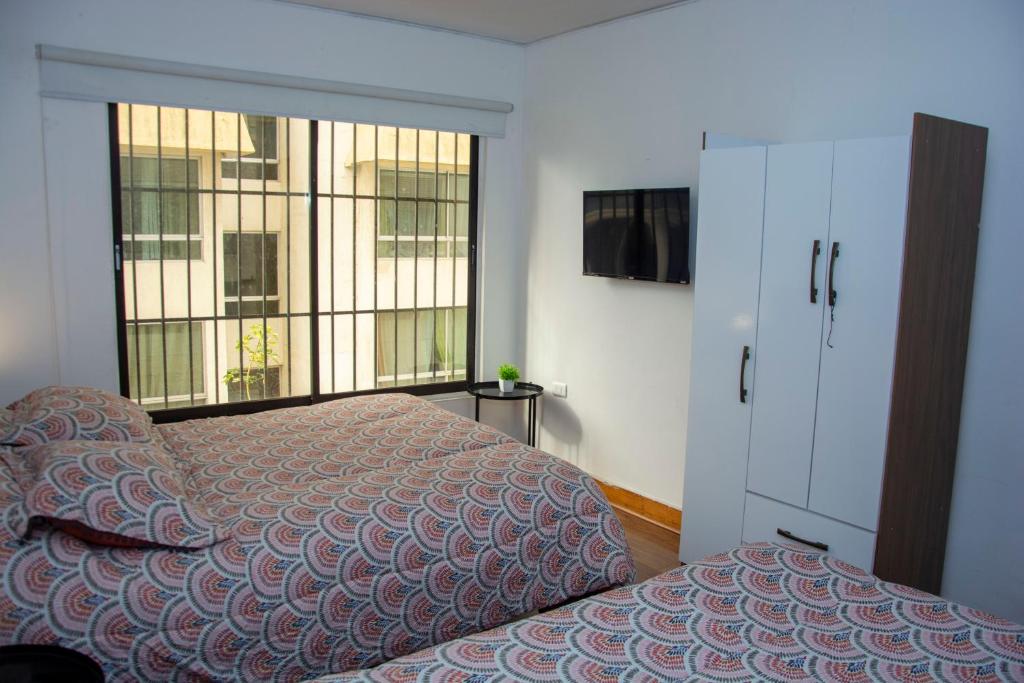 Postel nebo postele na pokoji v ubytování Hostal EntreOrientes
