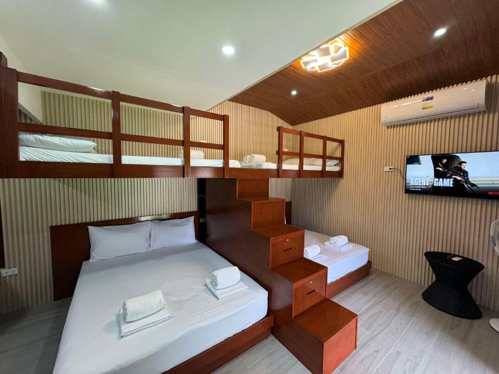 Postel nebo postele na pokoji v ubytování Youhan Beach Resort