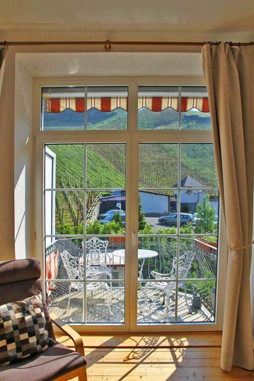 a room with a window with a view of a patio at Ferienwohnungen am Stadtpalais Fewo-Landshut in Bernkastel-Kues