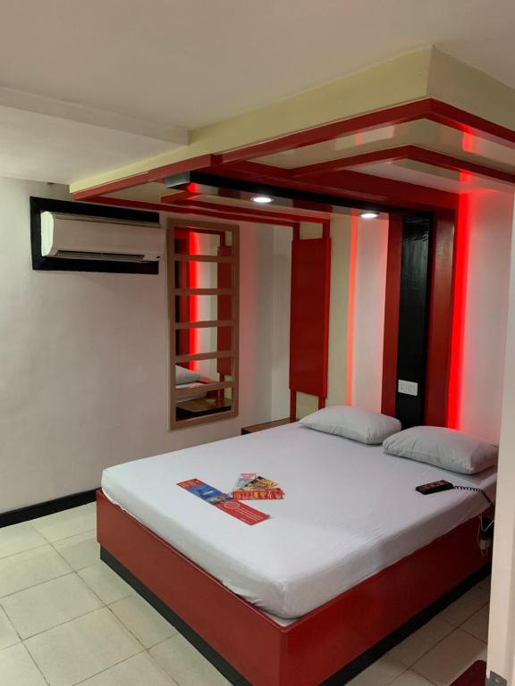 Postel nebo postele na pokoji v ubytování Hotel Sogo Davao