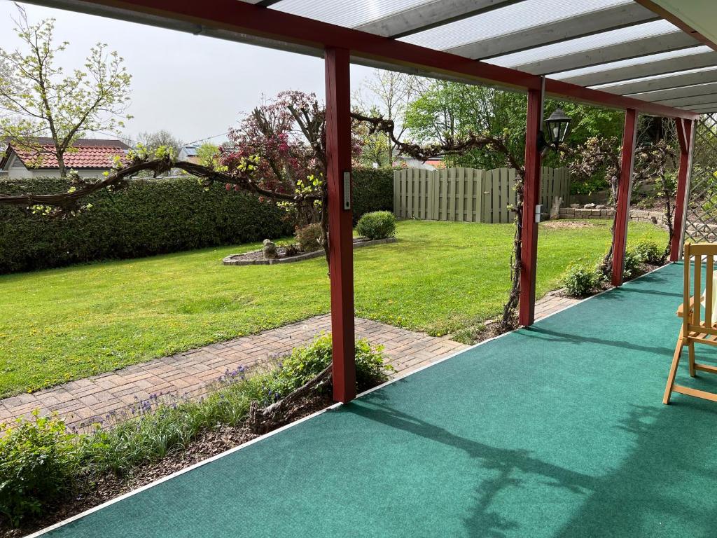 En have udenfor Das Nistkästchen