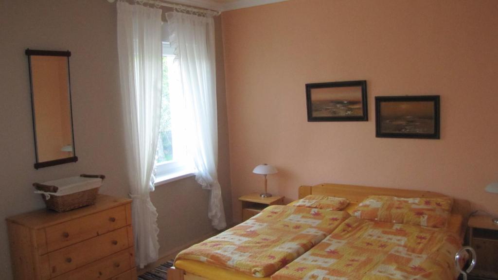 Postel nebo postele na pokoji v ubytování Alsóhegyi Apartmanok