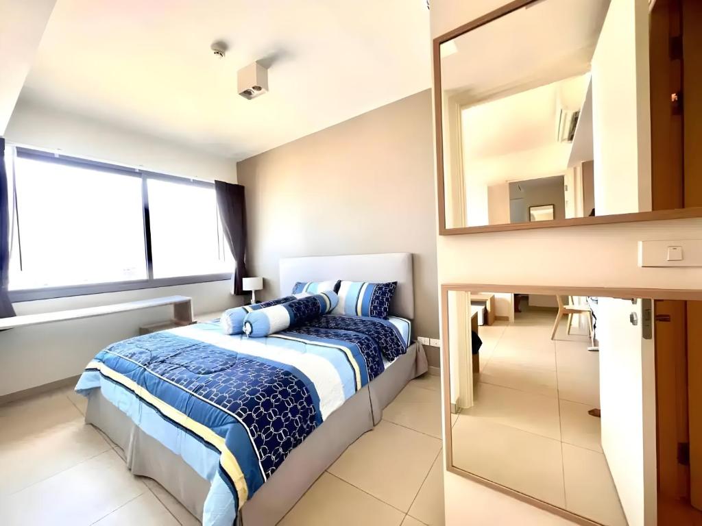 Ένα ή περισσότερα κρεβάτια σε δωμάτιο στο Sea View Condo with Amazing View