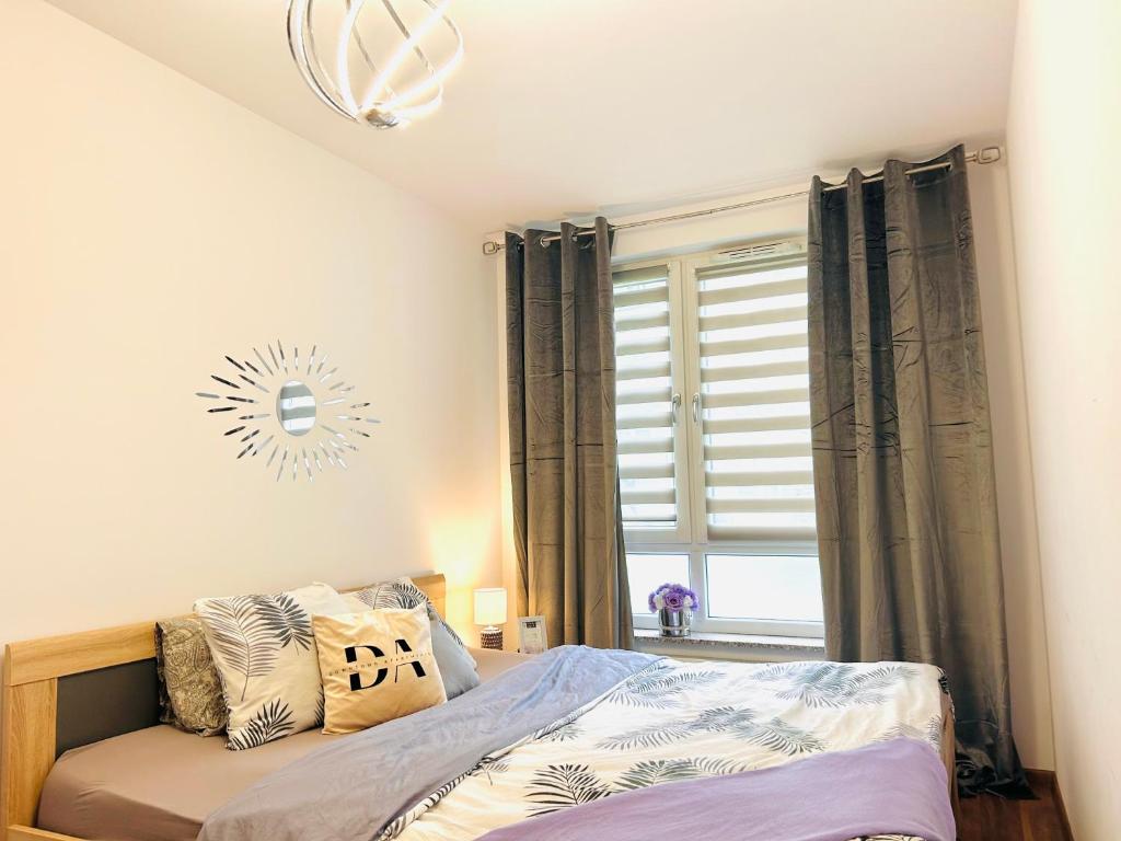 Posteľ alebo postele v izbe v ubytovaní Downtown Apartments Family&Friends