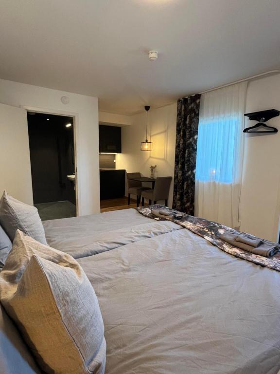 Postel nebo postele na pokoji v ubytování Brukshotellet