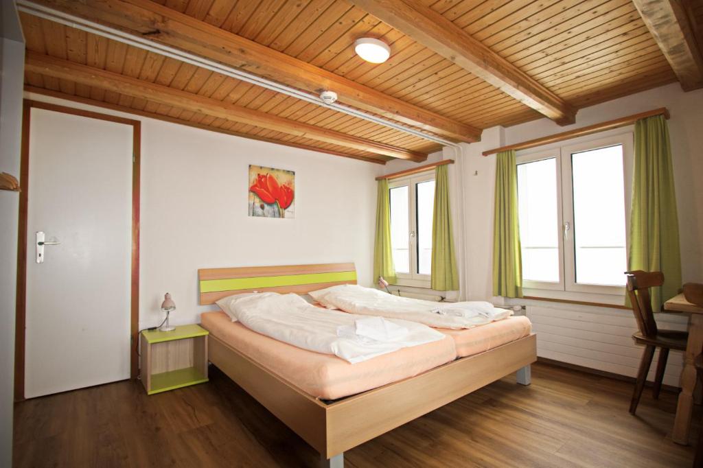 Postel nebo postele na pokoji v ubytování juhui Flumserberg