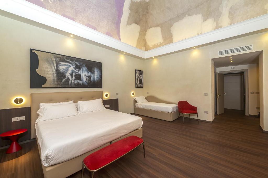 Postel nebo postele na pokoji v ubytování Hotel Vittoria