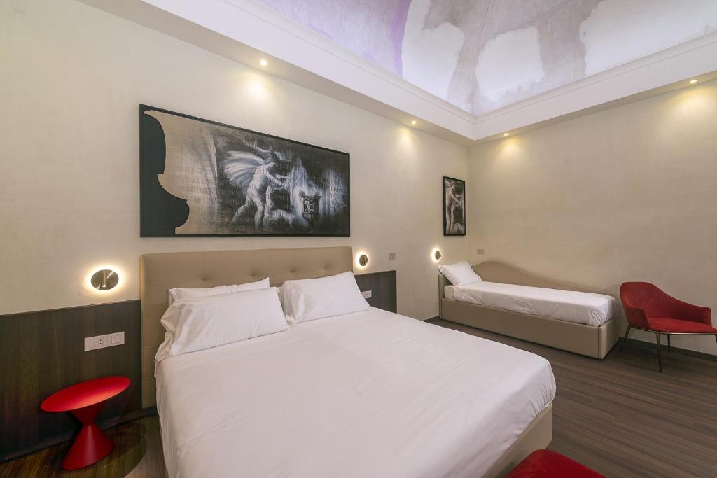 Postel nebo postele na pokoji v ubytování Hotel Vittoria
