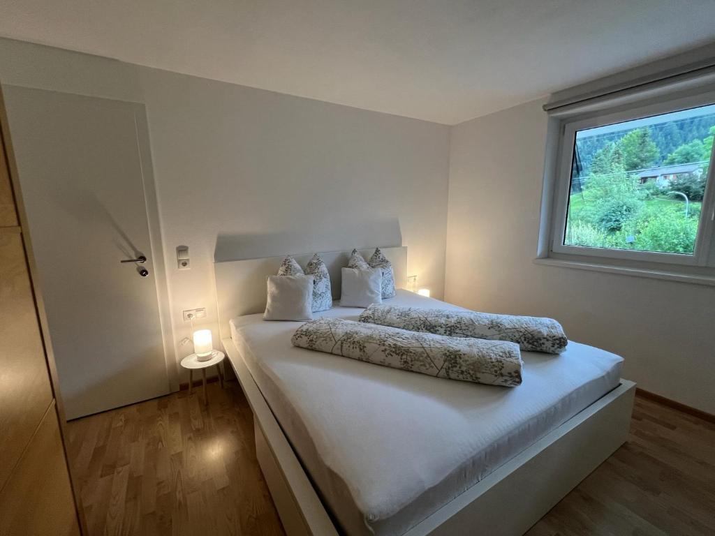 Postel nebo postele na pokoji v ubytování apart belmonte