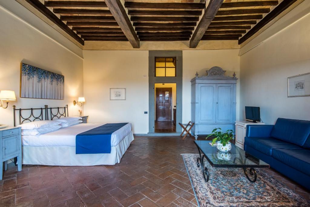 Postel nebo postele na pokoji v ubytování Hotel Palazzo Squarcialupi