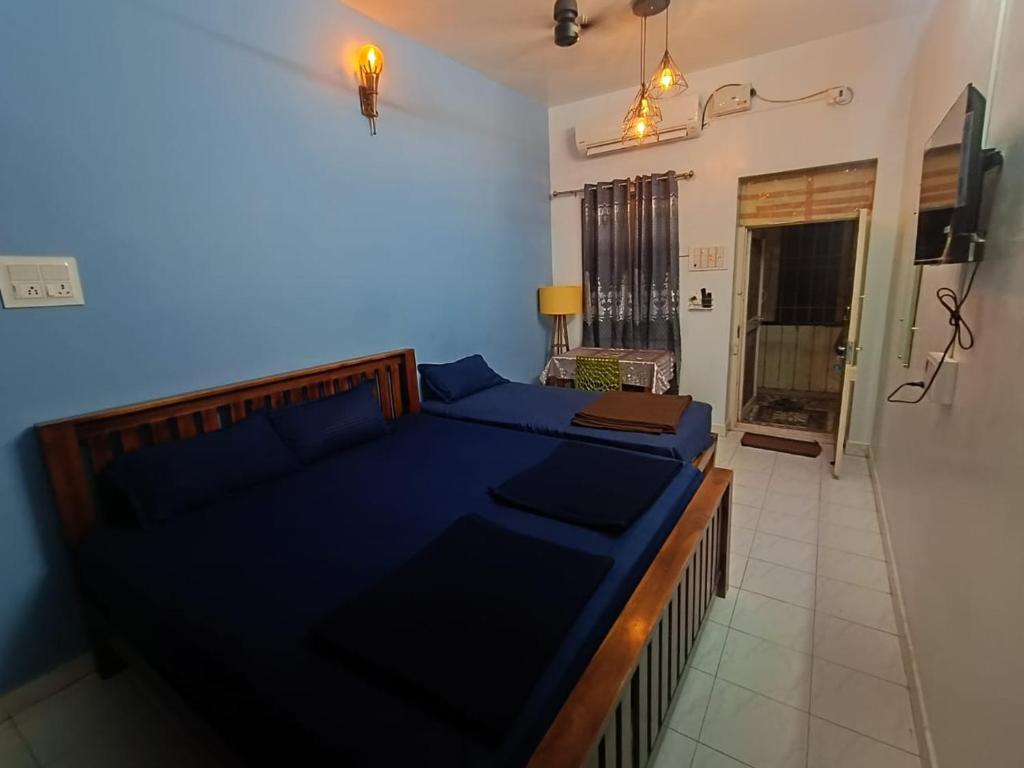 Voodi või voodid majutusasutuse Omkara - The Fives Guest house toas