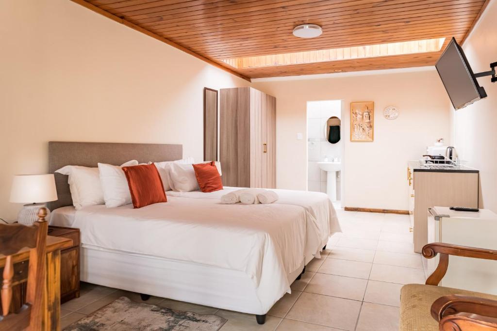 Ένα ή περισσότερα κρεβάτια σε δωμάτιο στο Dolliwarie Guesthouse