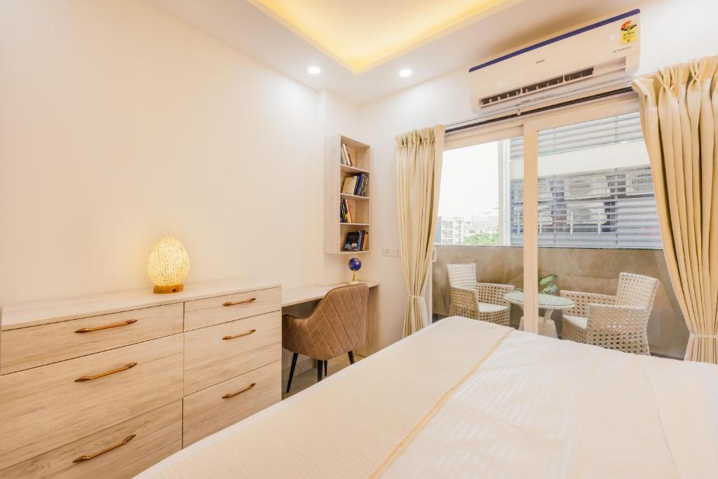 Postel nebo postele na pokoji v ubytování Kyomi Service Apartments