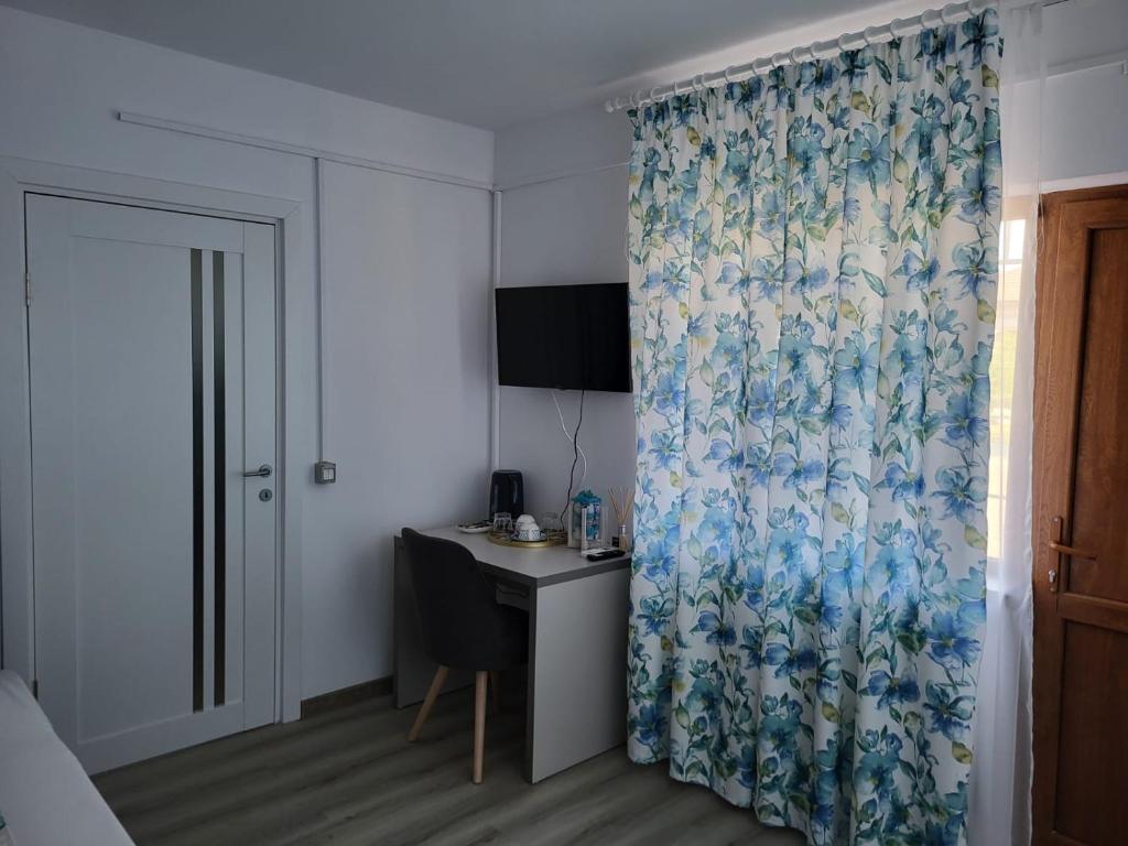 TV a/nebo společenská místnost v ubytování Casa Novis