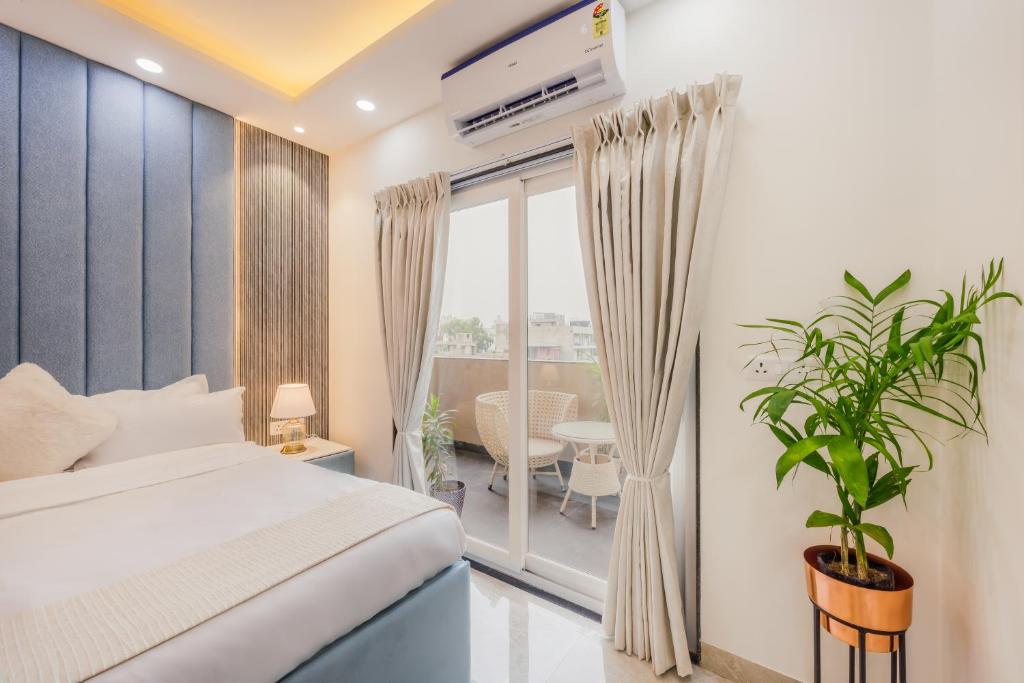 Postel nebo postele na pokoji v ubytování Kyomi Service Apartments