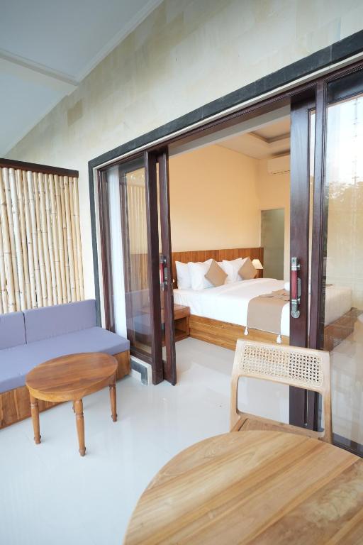 Postel nebo postele na pokoji v ubytování Winaka Ubud