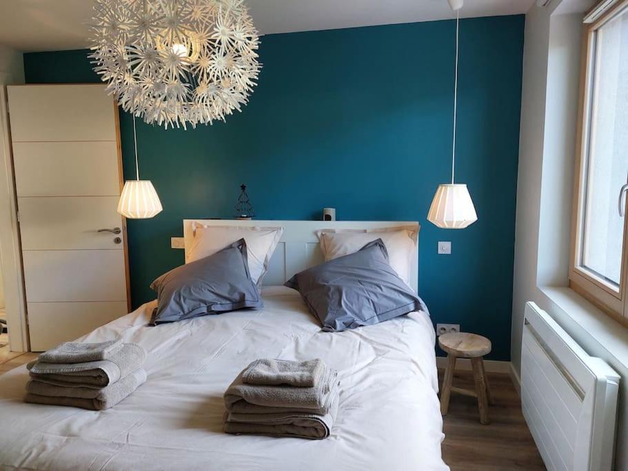 En eller flere senge i et værelse på Maison 120 m2 à Gerardmer proche centre ville