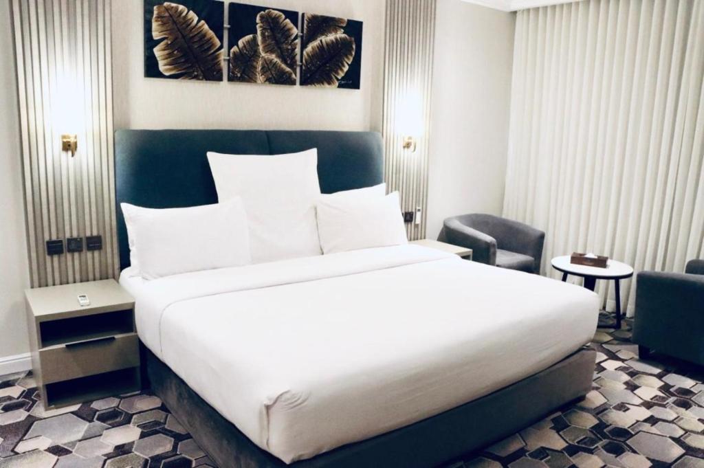Postel nebo postele na pokoji v ubytování Continent Al Waha Hotel Riyad