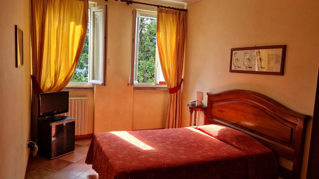 Postel nebo postele na pokoji v ubytování Hotel Aquadolce