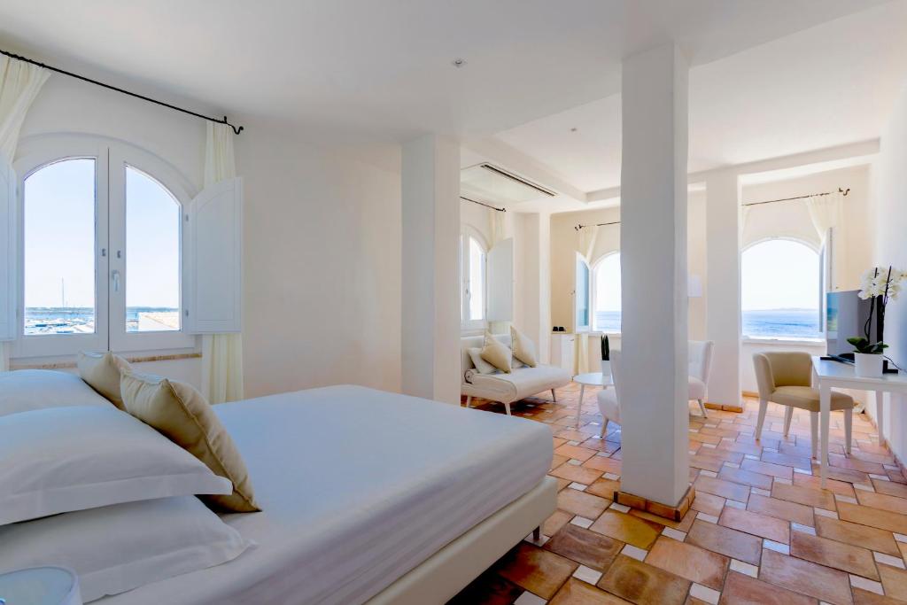 Posteľ alebo postele v izbe v ubytovaní Relais La Ghinghetta