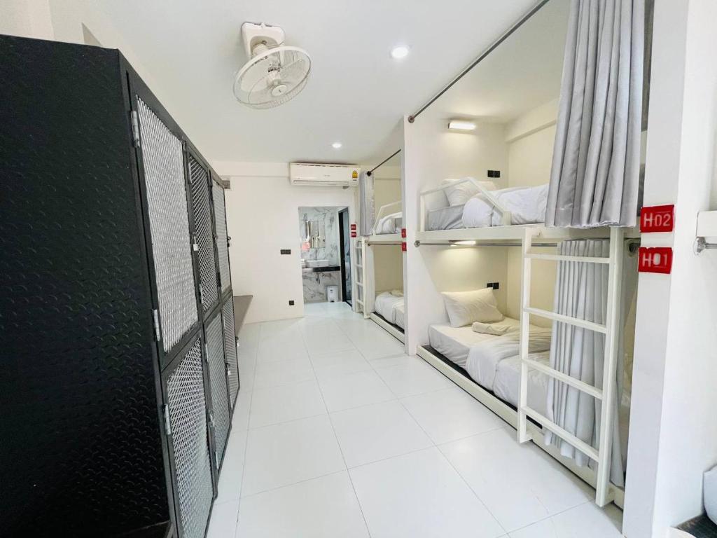 Postel nebo postele na pokoji v ubytování Koh Samui Beach Hotel
