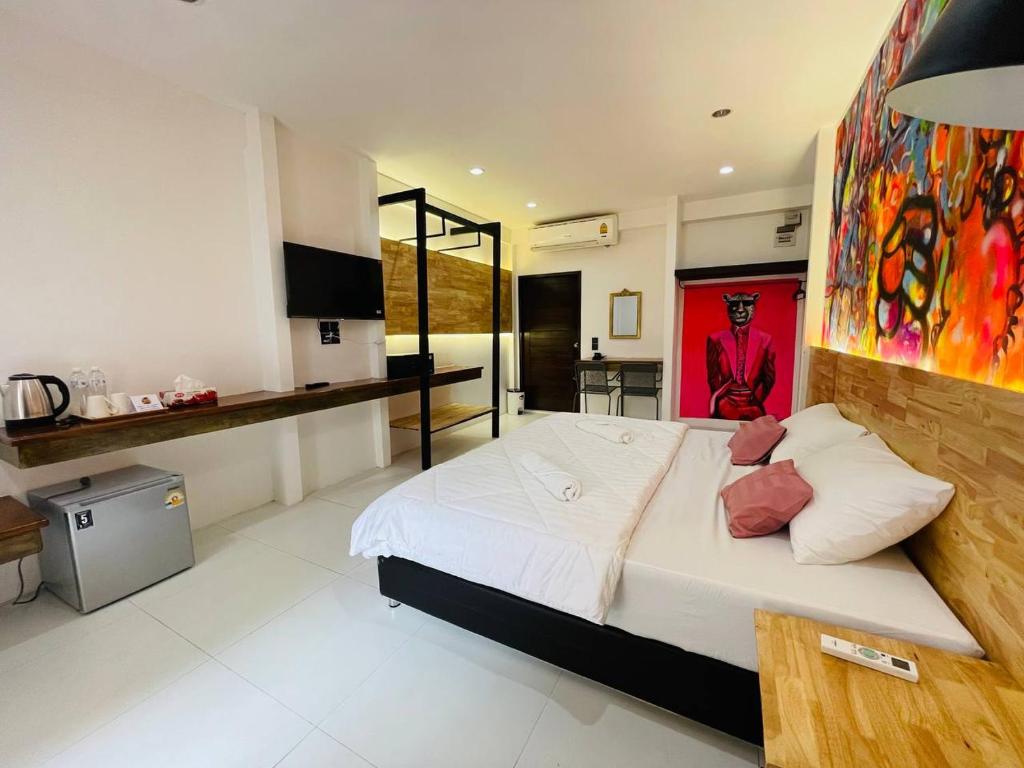 Postel nebo postele na pokoji v ubytování Koh Samui Beach Hotel