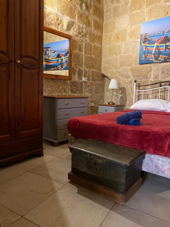Postel nebo postele na pokoji v ubytování Ta' Marta Lodge