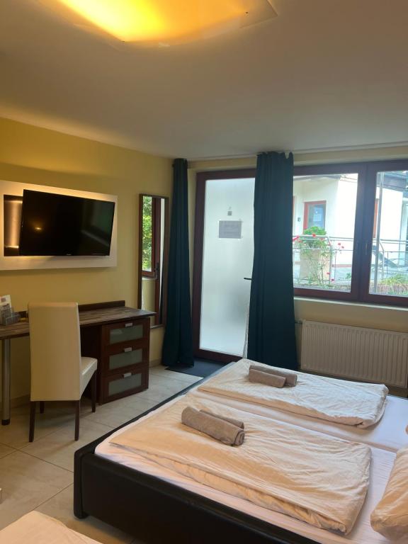 Postel nebo postele na pokoji v ubytování Hotel Scheunenwerk - Nürnberg Nord