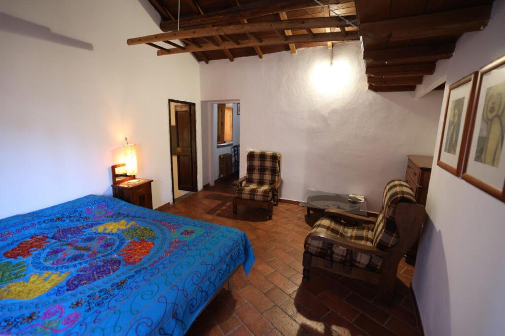 A bed or beds in a room at Casamatta a Blera