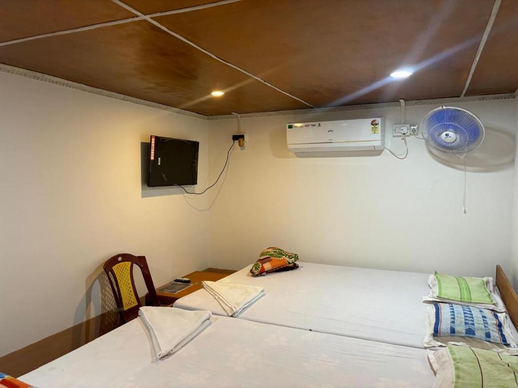 Postel nebo postele na pokoji v ubytování Tapama Resort Bakkhali