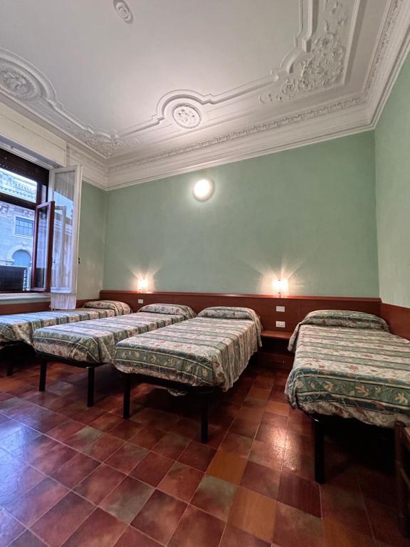 Postel nebo postele na pokoji v ubytování Hotel Barone