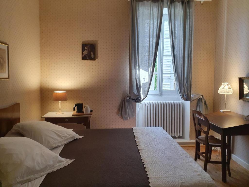 Postel nebo postele na pokoji v ubytování Chambres d'hôtes La Hourqueyre