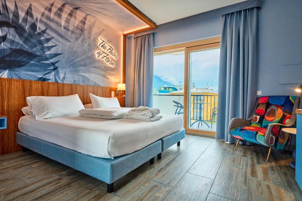 Postel nebo postele na pokoji v ubytování Parc Hotel Flora S