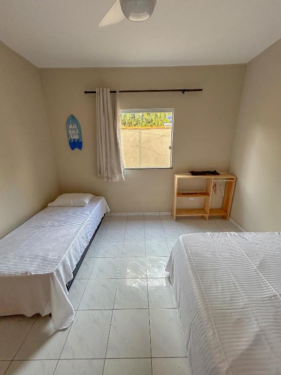 Postel nebo postele na pokoji v ubytování Surf Stop Hostel Serra Grande