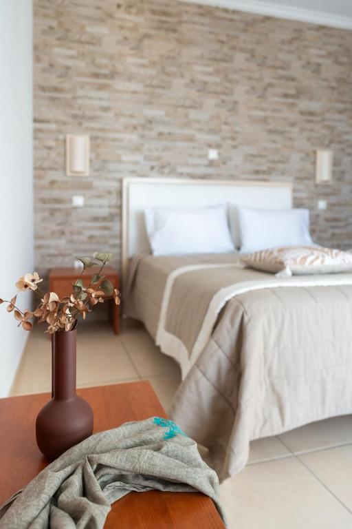 A bed or beds in a room at Al Mare Villas