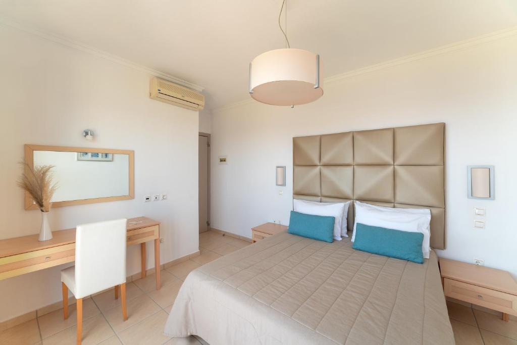 A bed or beds in a room at Al Mare Villas