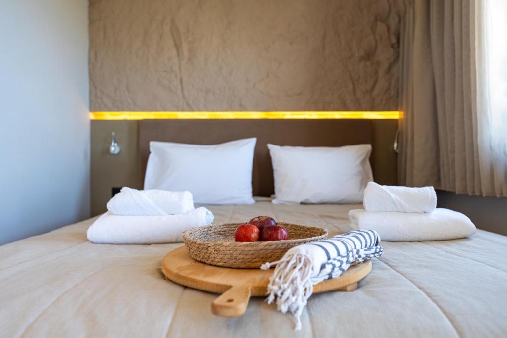 A bed or beds in a room at Al Mare Villas