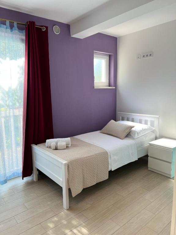 Postel nebo postele na pokoji v ubytování Villa Drinka Apartments