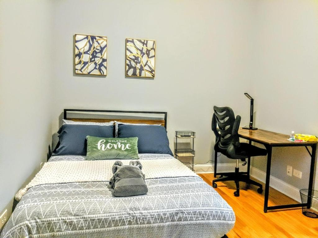 a bedroom with a bed with a teddy bear on it at Fully furnished bedroom near medical district and UIC in Chicago