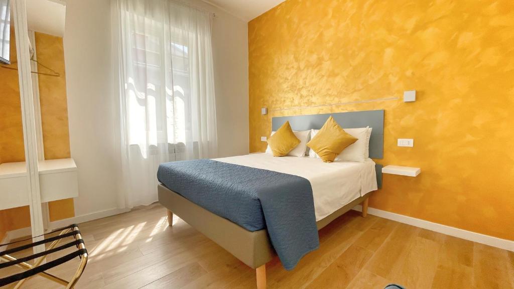 En eller flere senge i et værelse på Color Houses Pescara Centro