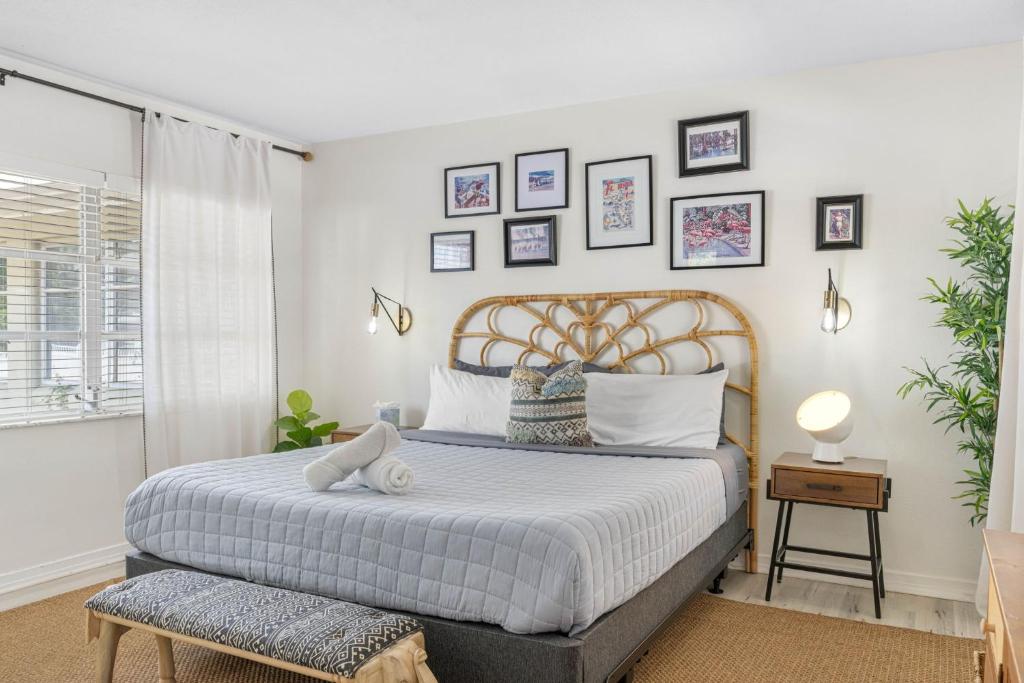a bedroom with a large bed and a window at St Pete Boho Getaway Walk to Pier and Beach in St. Petersburg